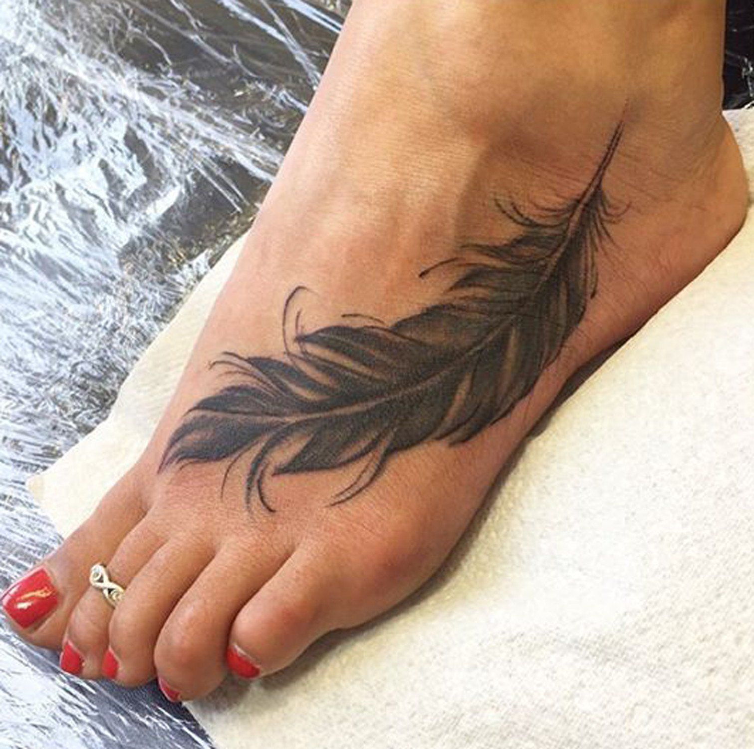 55 Adorable Feather Tattoos On Foot Leg Tattoo Designs