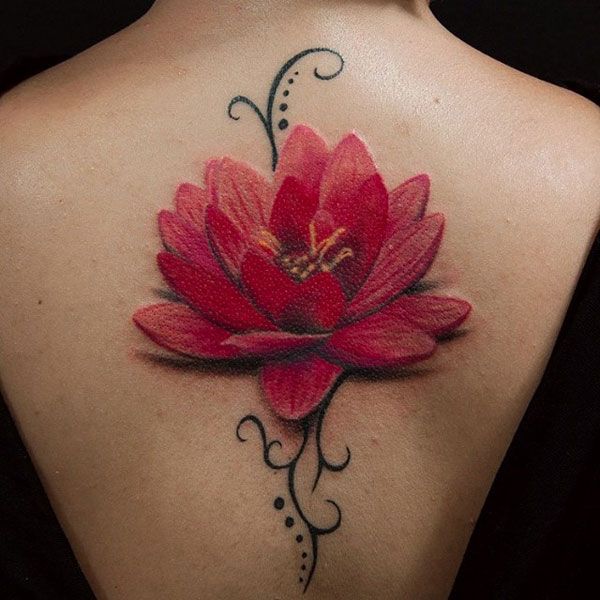 A Black And Red Lotus Tattoo On The Back Of A Woman S Shoulder