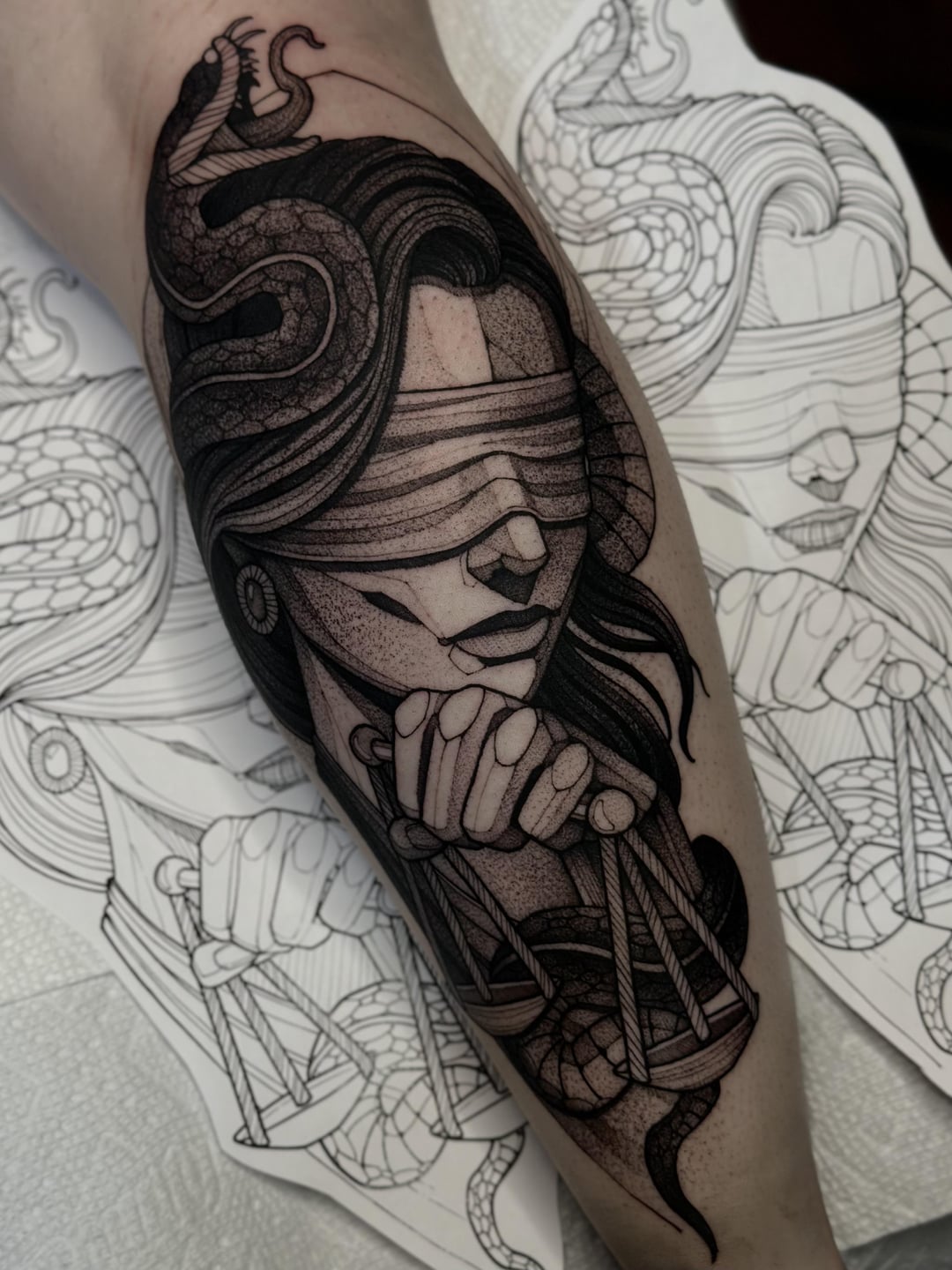 A Lady Justice Tattoo On The Arm