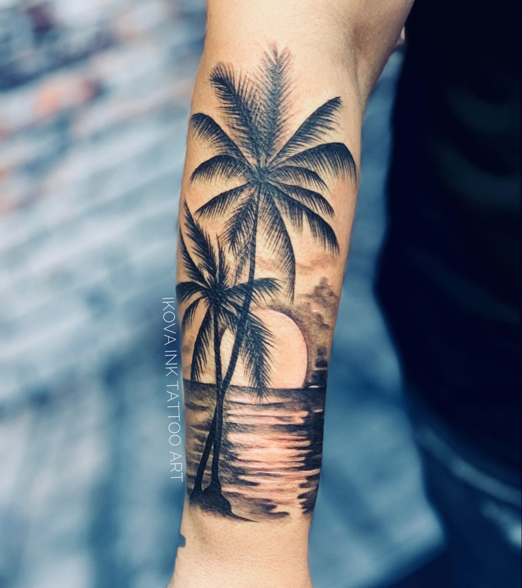 A Man S Arm With A Palm Tree And Two People On The Beach Tattoo