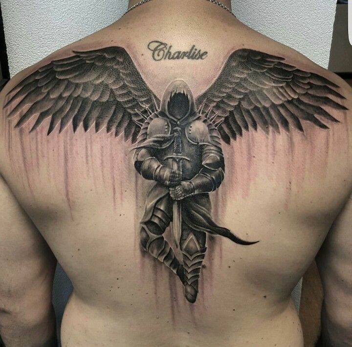 A Man S Back With An Angel Tattoo On It