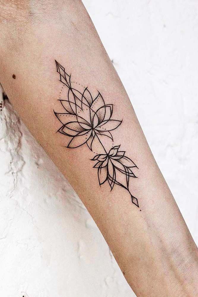 A Small Lotus Tattoo On The Left Side Of The Arm With Dots In It