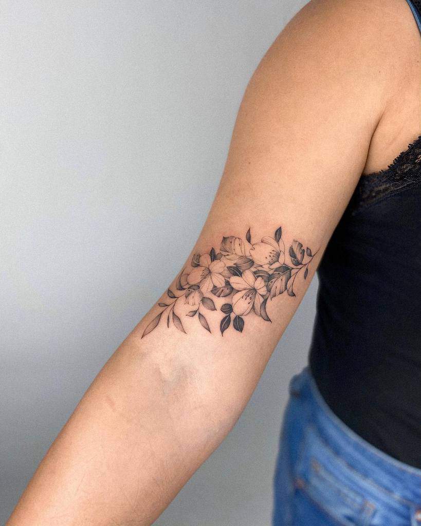 A Tattoo On The Arm Of A Woman With A Large Flower In It Amp 39 S Center