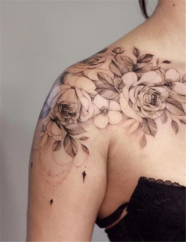 A Woman S Shoulder With Flowers On It