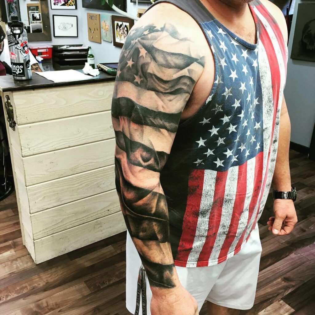 American Traditional Style Colored Shoulder Tattoo Of Flag With