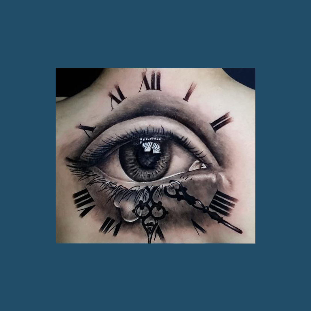 An Eye And Clock Tattoo Design