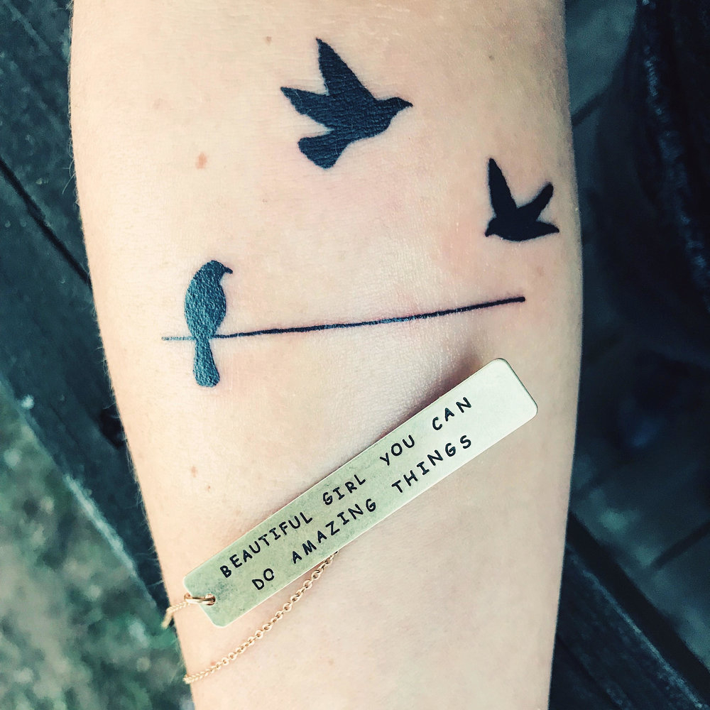 Birds On A Wire Tattoo Located On The Tricep