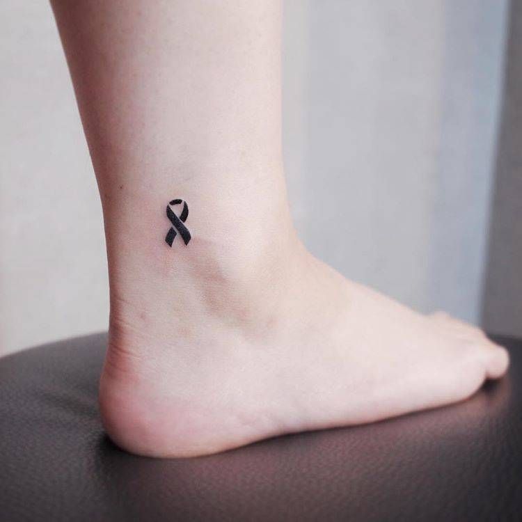 Black Ribbon Tattoo On The Ankle Pink Ribbon Tattoos Awareness Ribbons Tattoo Ribbon Tattoos