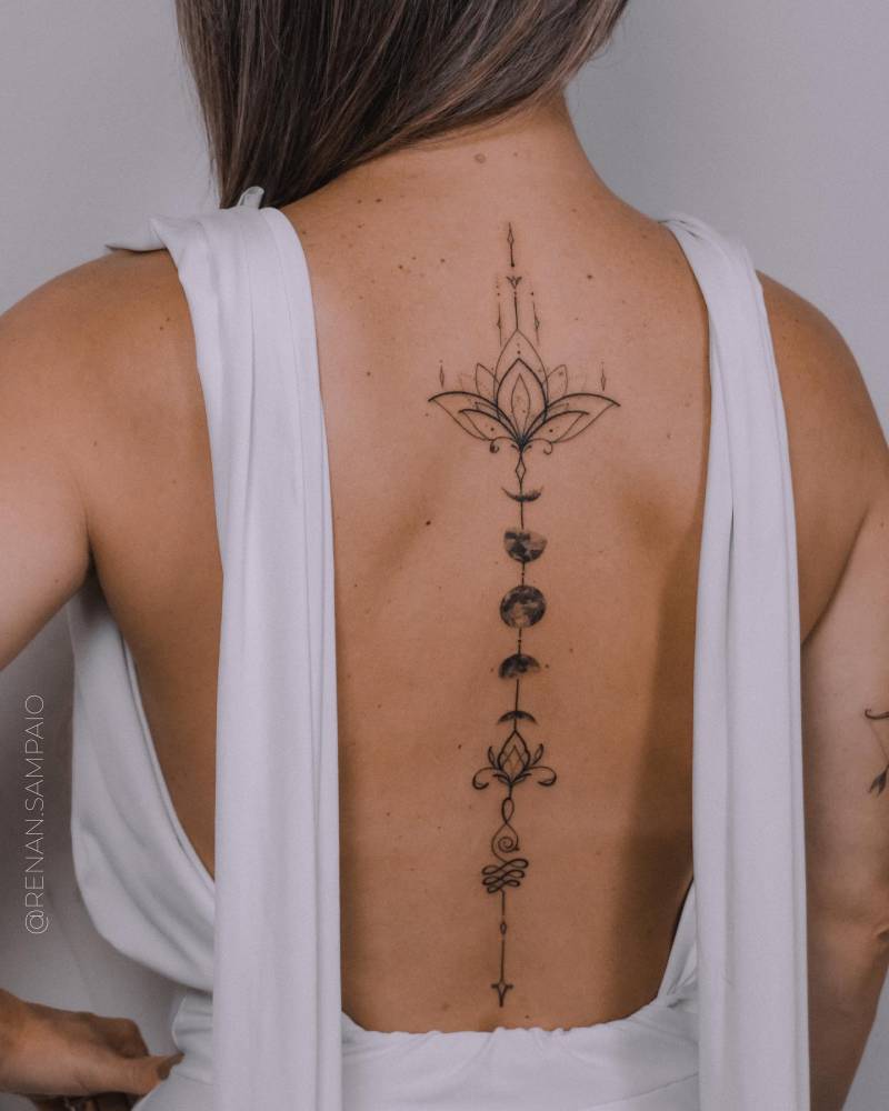 Celestial Beauty Moon Phases Floral Spine Tattoo