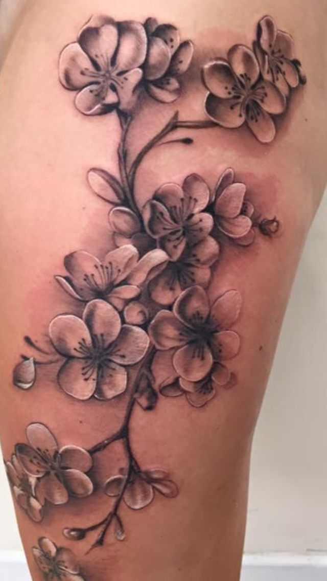 Cherry Blossom Thigh Tattoo Ideas: Elegant Ink Inspiration