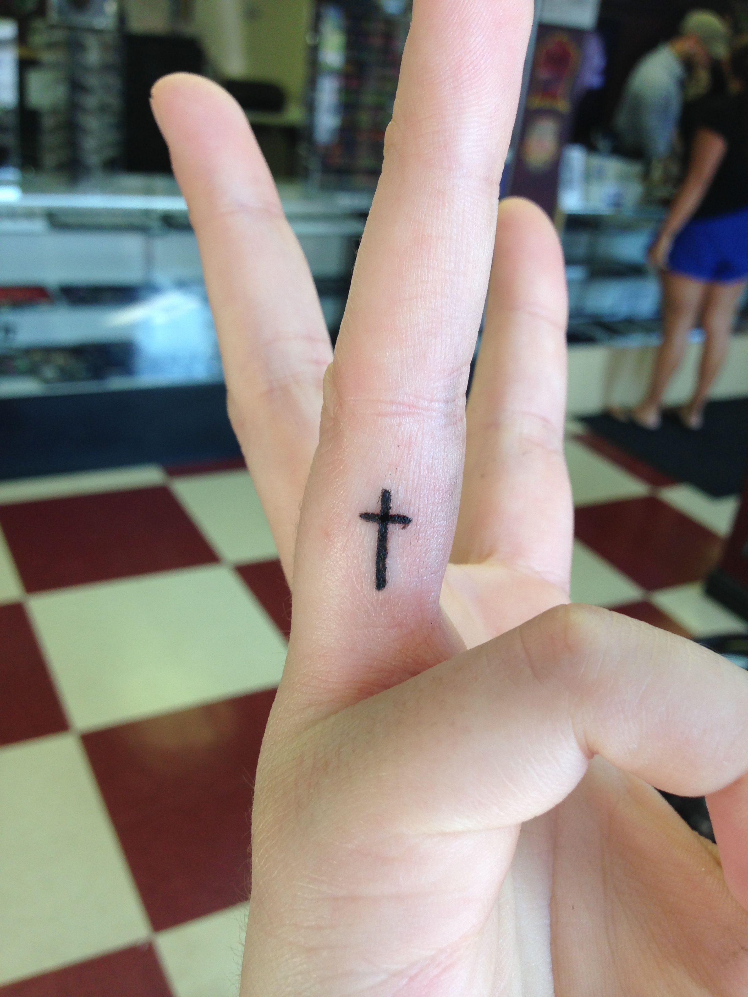 Cross Finger Tattoo