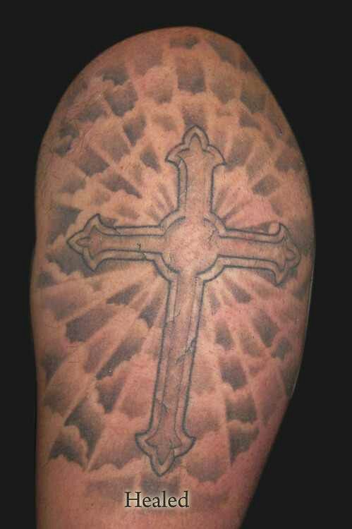 Cross With Sun Rays Tattoo: Meaning and Design Ideas