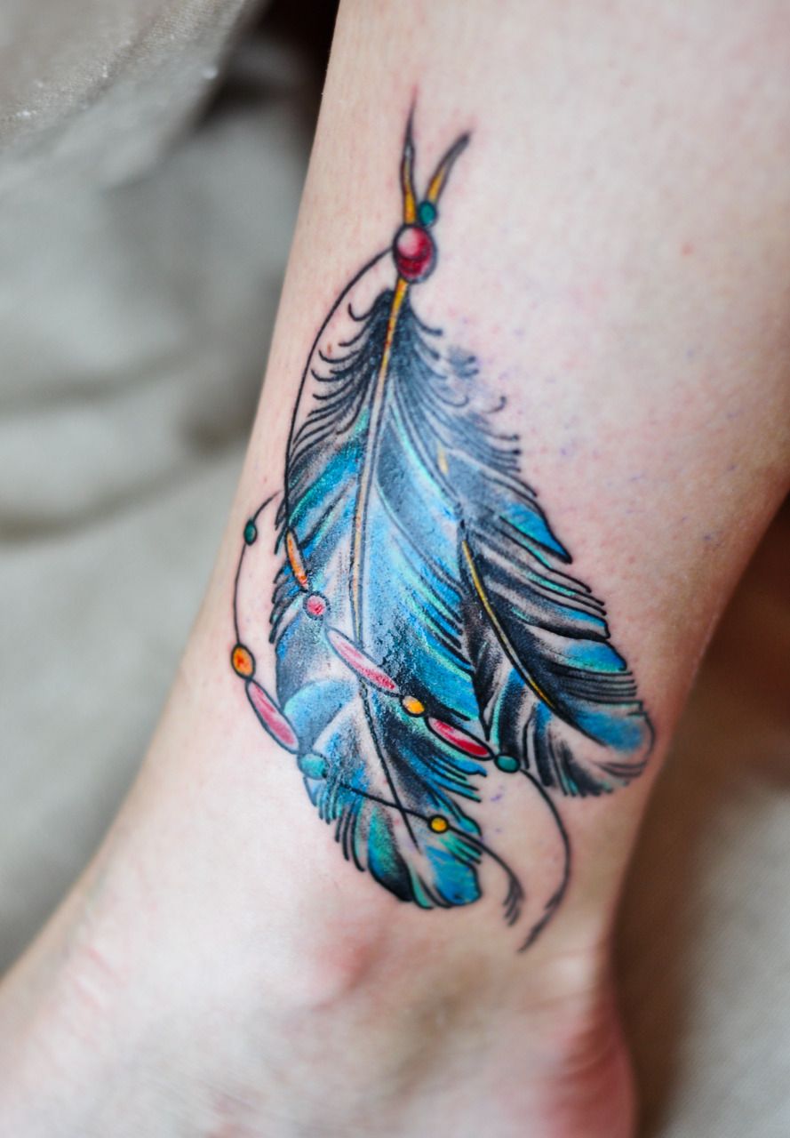 Indian Feather Tattoo Designs With Skull Indian Feather Tattoos