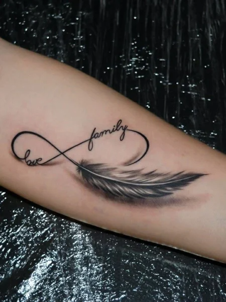 Infinity Feather Tattoo On Exterior Forearm Boom Tattoos Tattoo Shop In