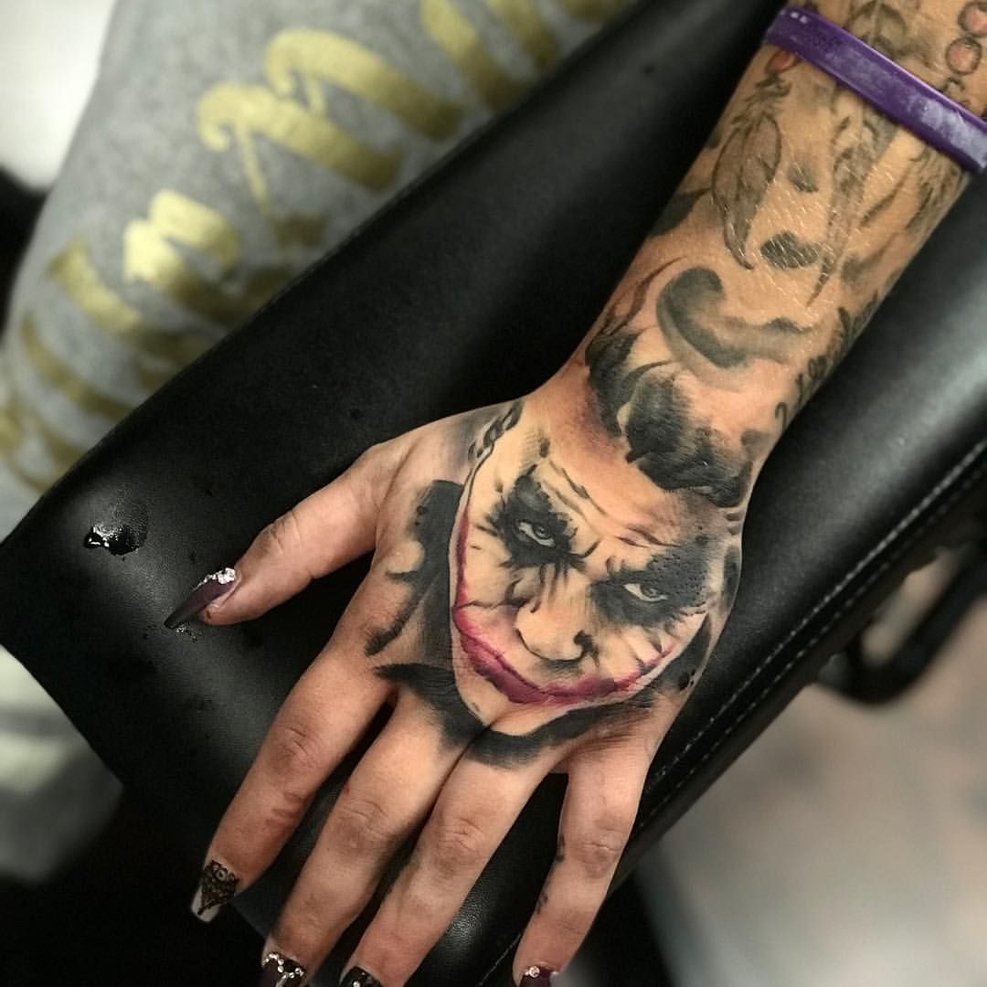 5 Meanings Behind the Joker Smiling Hand Tattoo