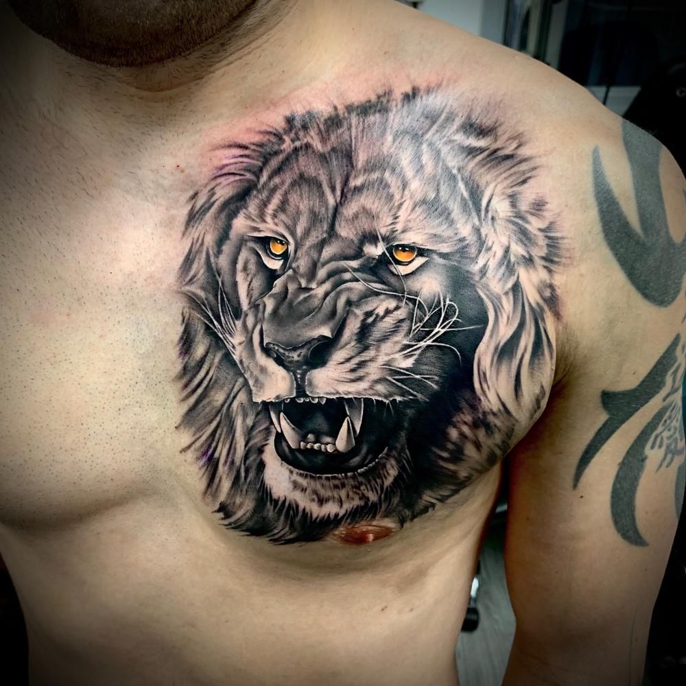 Majestic Lion Tattoos: Bold Chest Ink Designs