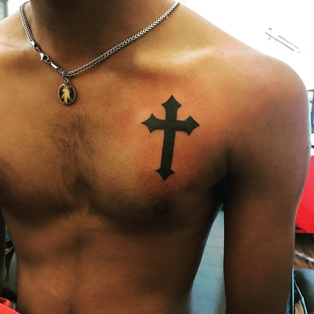 5 Powerful Meanings of Men's Cross Arm Tattoos