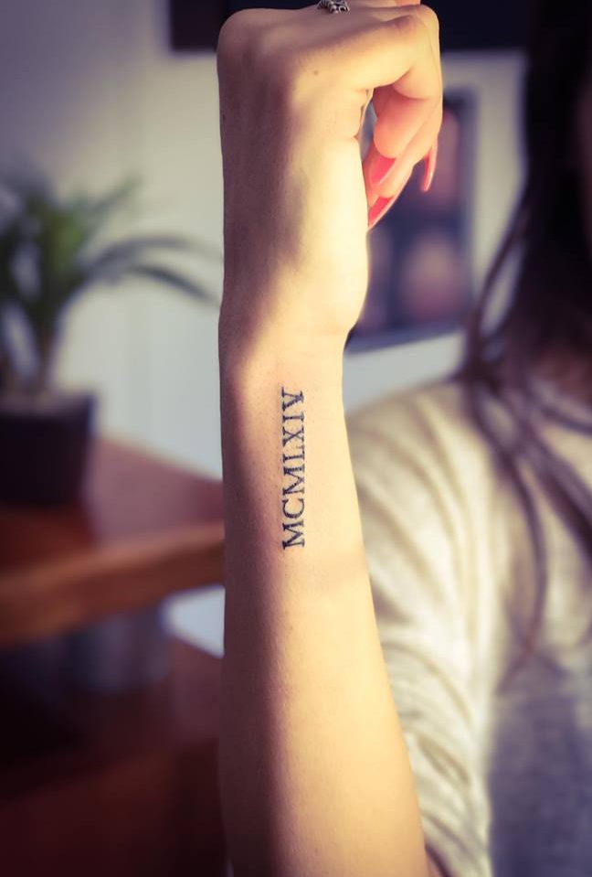 Minimal Roman Numerals Tattoo On Wrist Blurmark