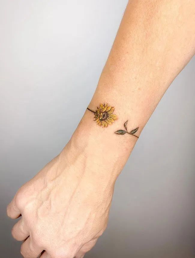 Minimalist Sunflower Tattoo On The Wrist Sunflower Tattoo Simple Sunflower Tattoo On Wrist