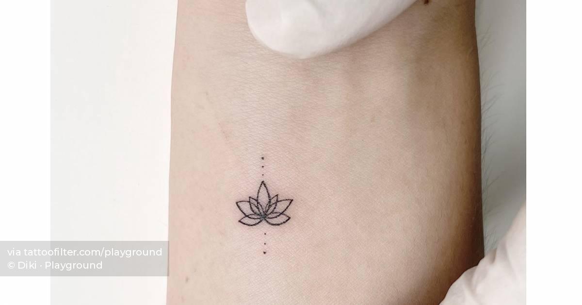 Minimalistic Lotus Flower Tattooed At The Back Of The Small Lotus