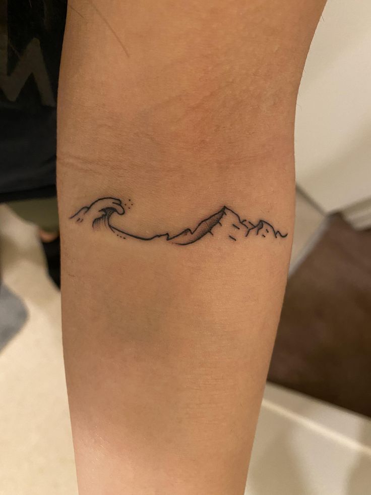 Mountain and Wave Tattoo Designs: Symbolism and Inkspiration