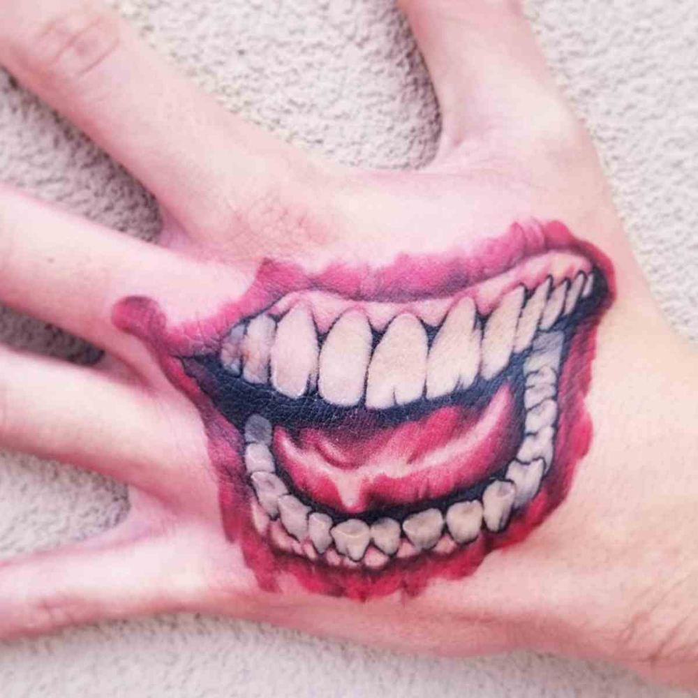 Pin By Sara Pascolini On Harley Amp Joker Joker Smile Hand Tattoo Smile Tattoo Joker Smile Tattoo