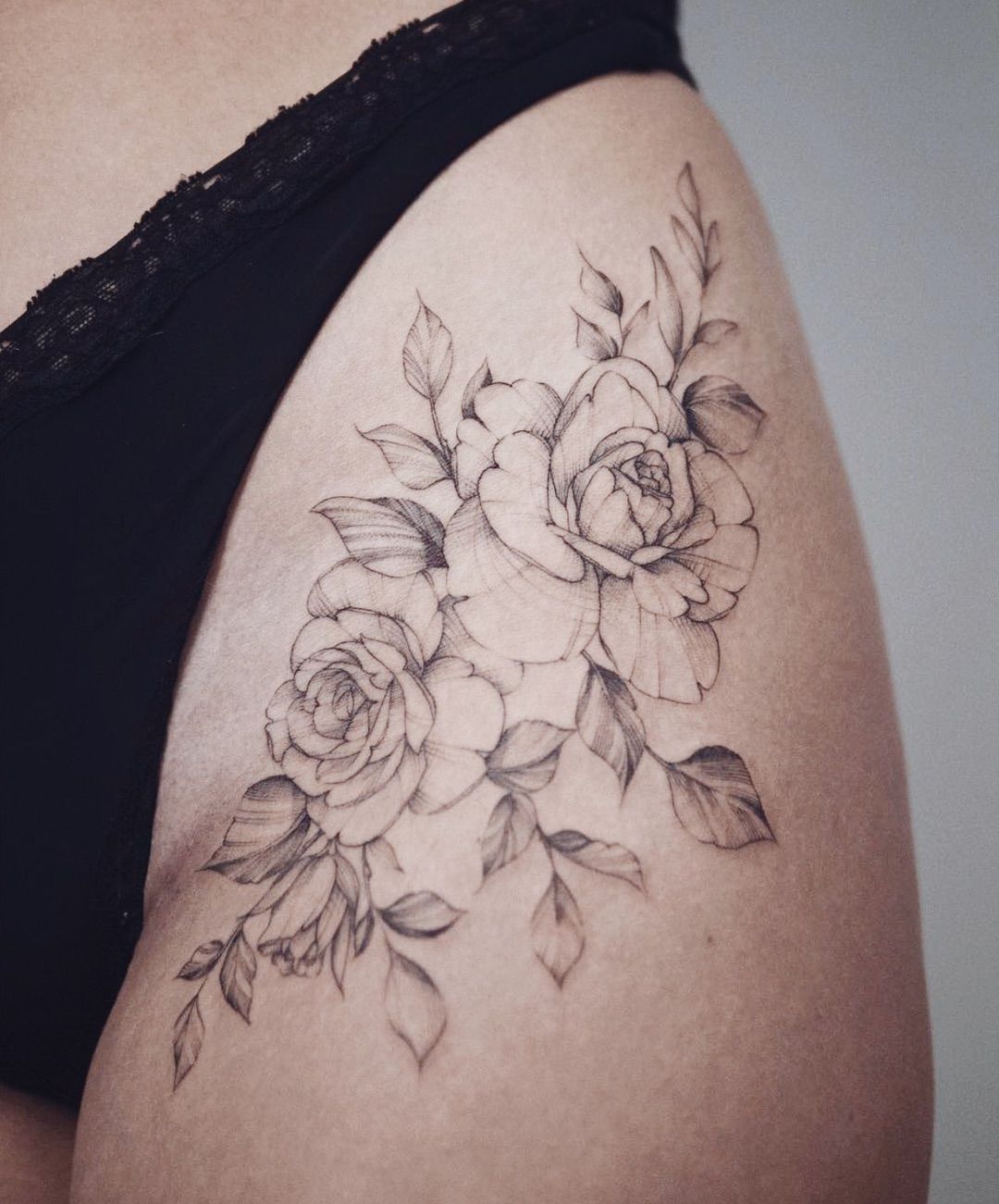 Rose Hip Thigh Tattoo