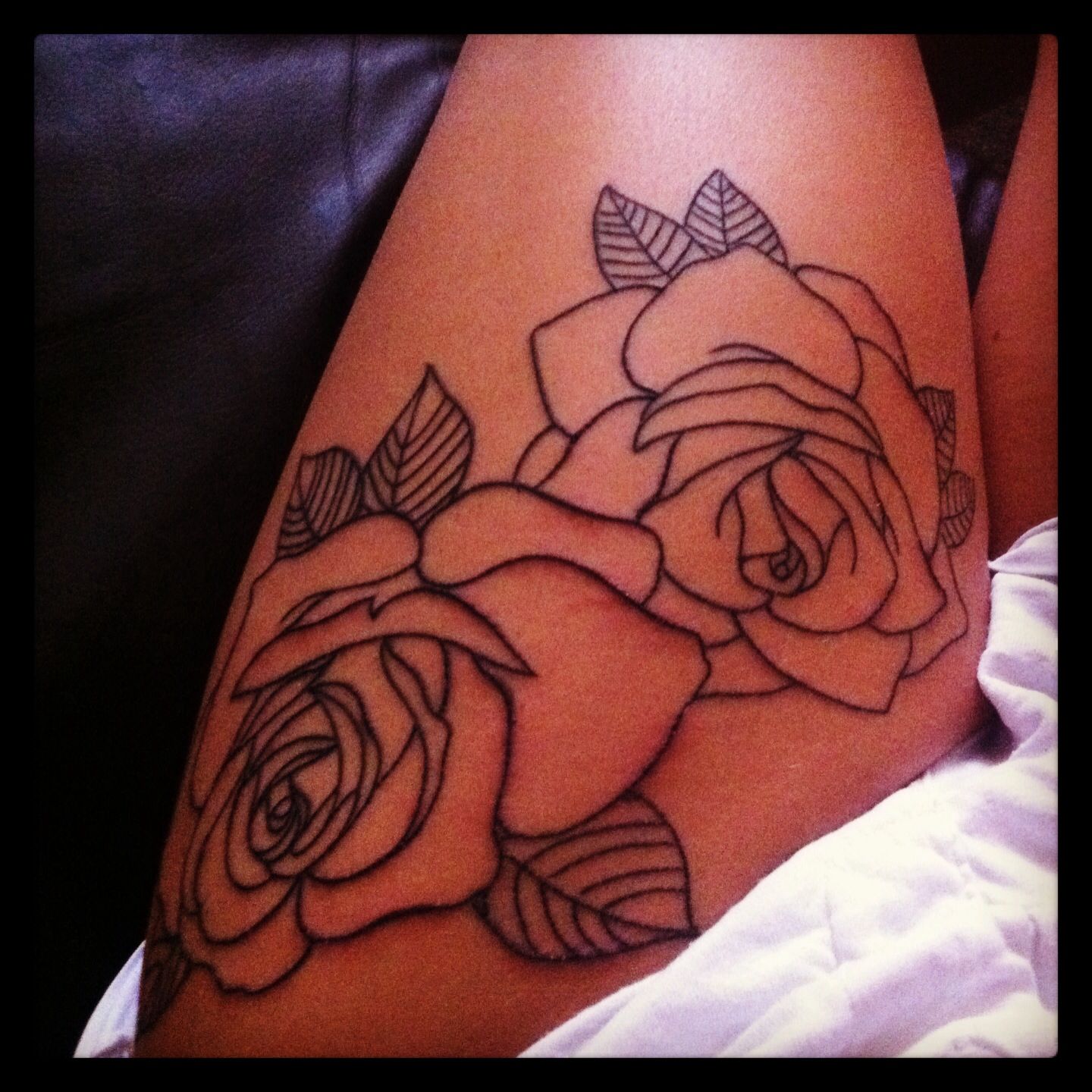 Rose Tattoos on Thighs: Elegant Designs Explained