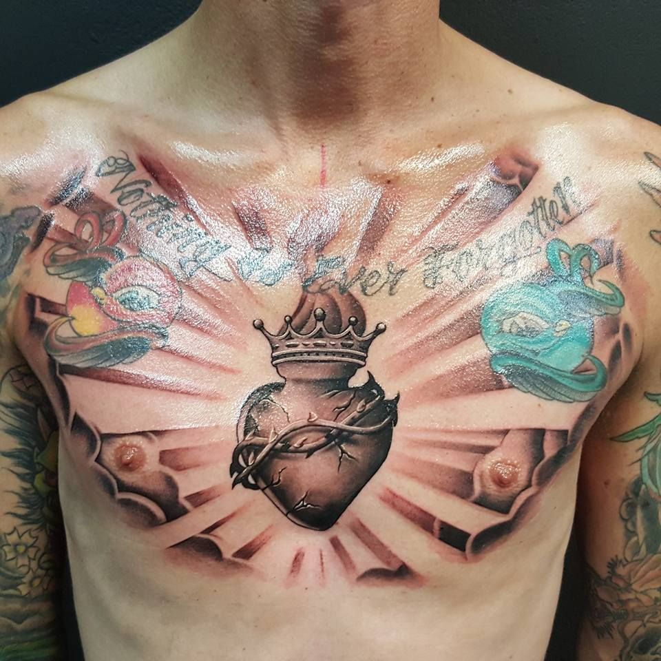 5 Stunning Sacred Heart Tattoo Designs for Your Chest