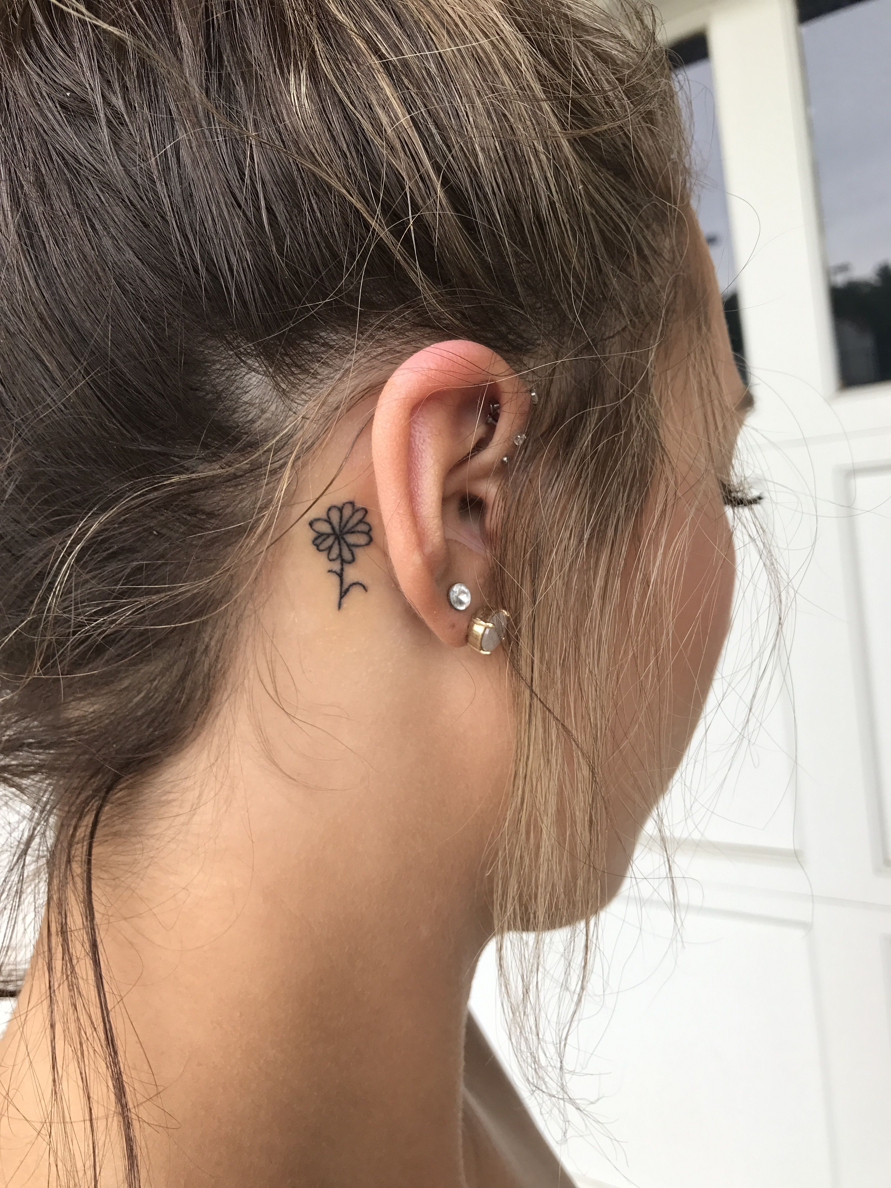 Simple Lotus Flower Tattoo Behind Ear