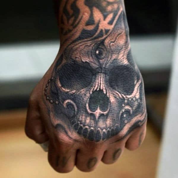 Skull Hand Tattoos: Bold Designs for Men