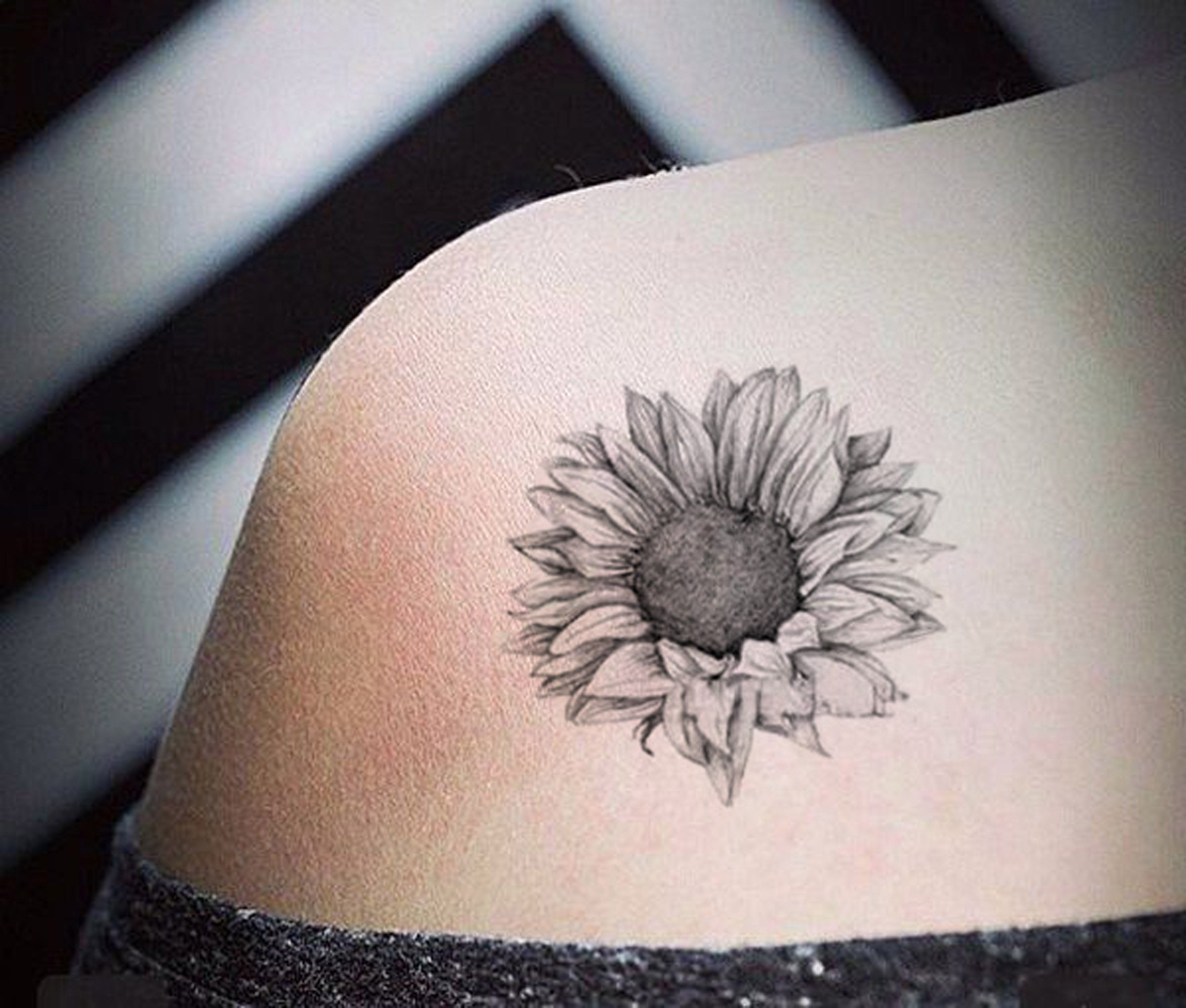 Small Black And Grey Sunflower Tattoo