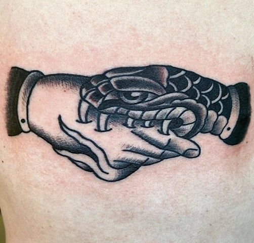 5 Symbolic Meanings Behind Snake Bites Hand Tattoo