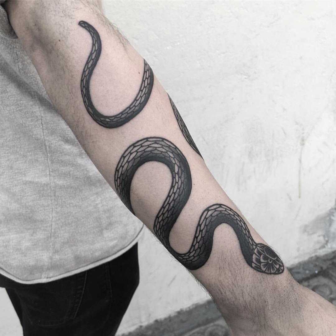 Snake Tattoo Wrapping Around Arm: Designs and Meanings