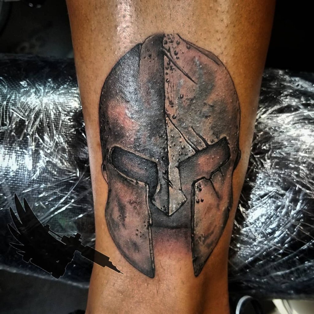 10 Epic Spartan Helmet Tattoo Designs for Warriors