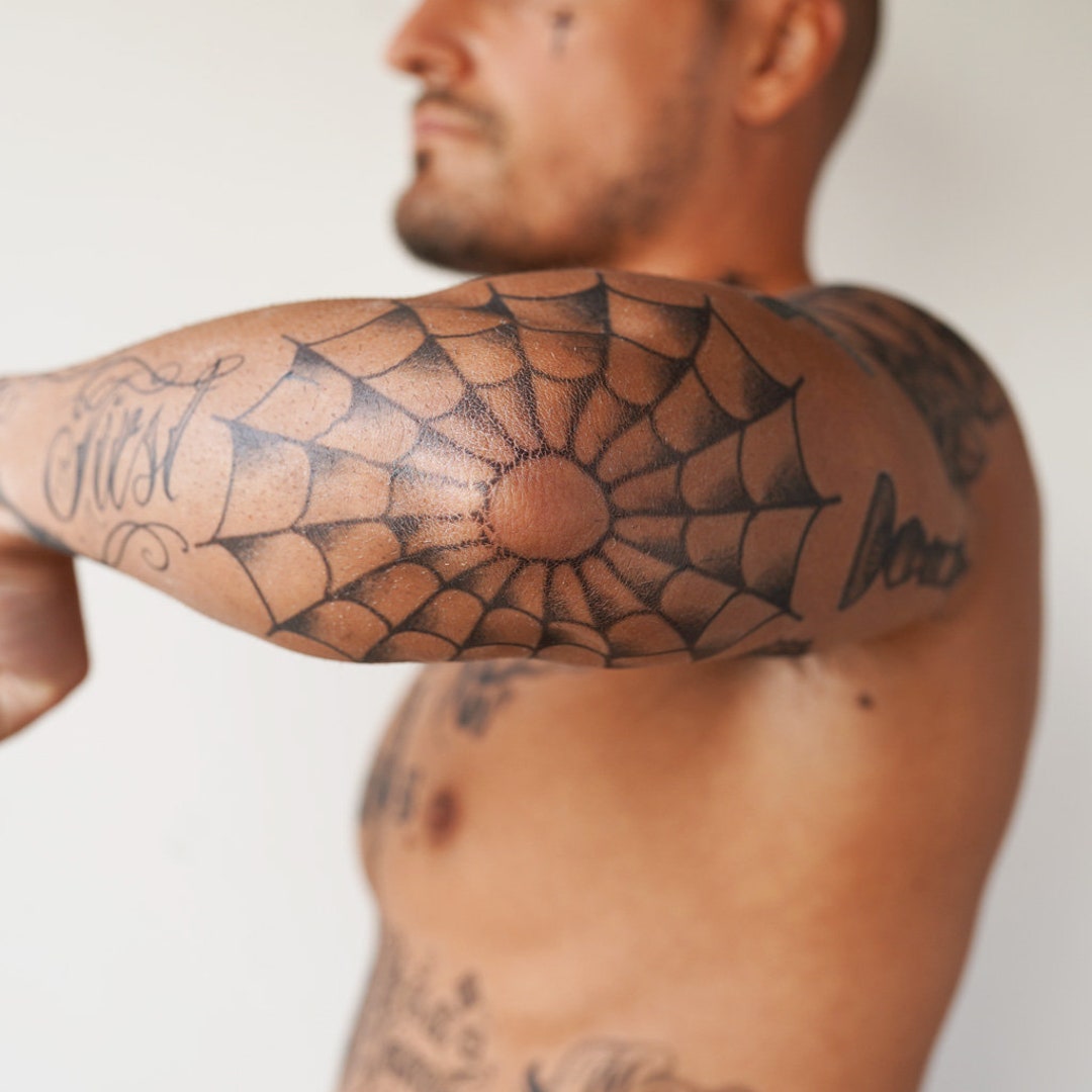 Spiderweb Tattoo Located On The Elbow Traditional