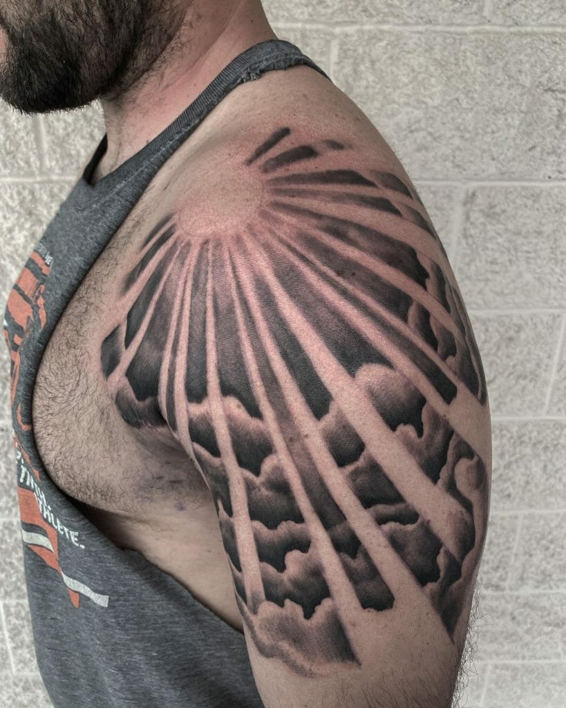 Sun Rays Through Clouds Chest Tattoo