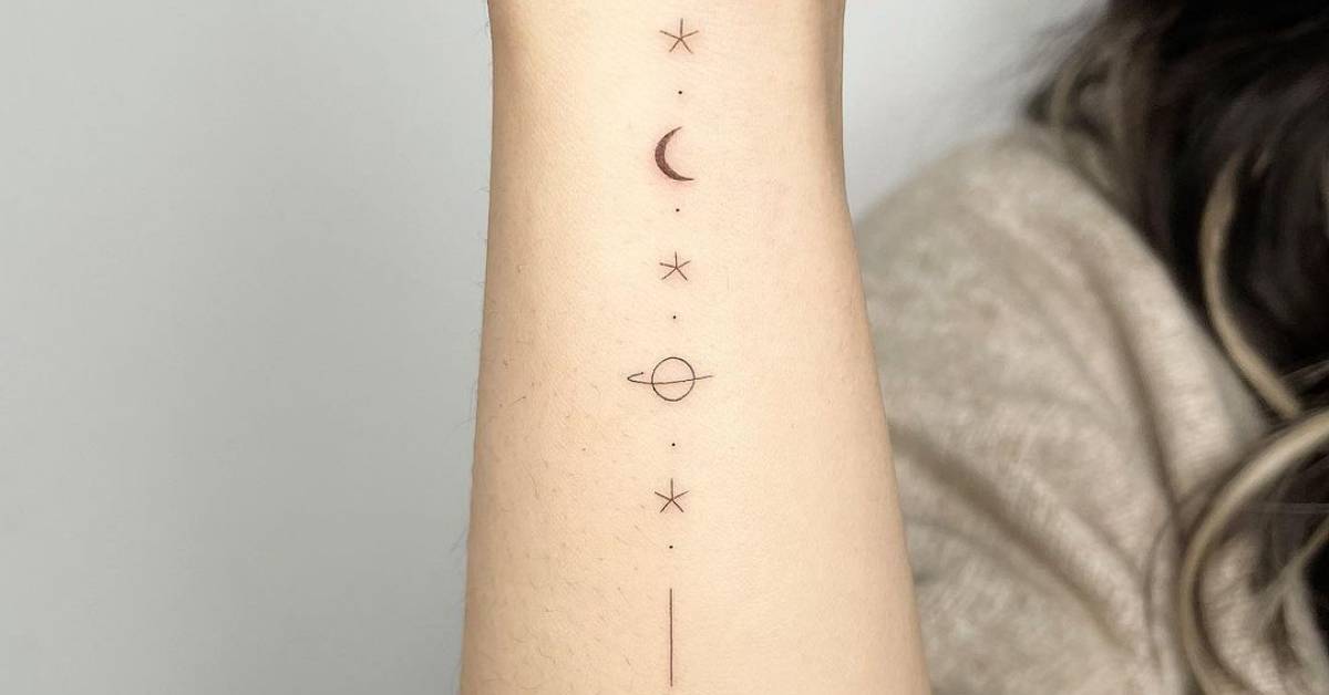 Tattoo Of A Minimalistic Galaxy Located On The