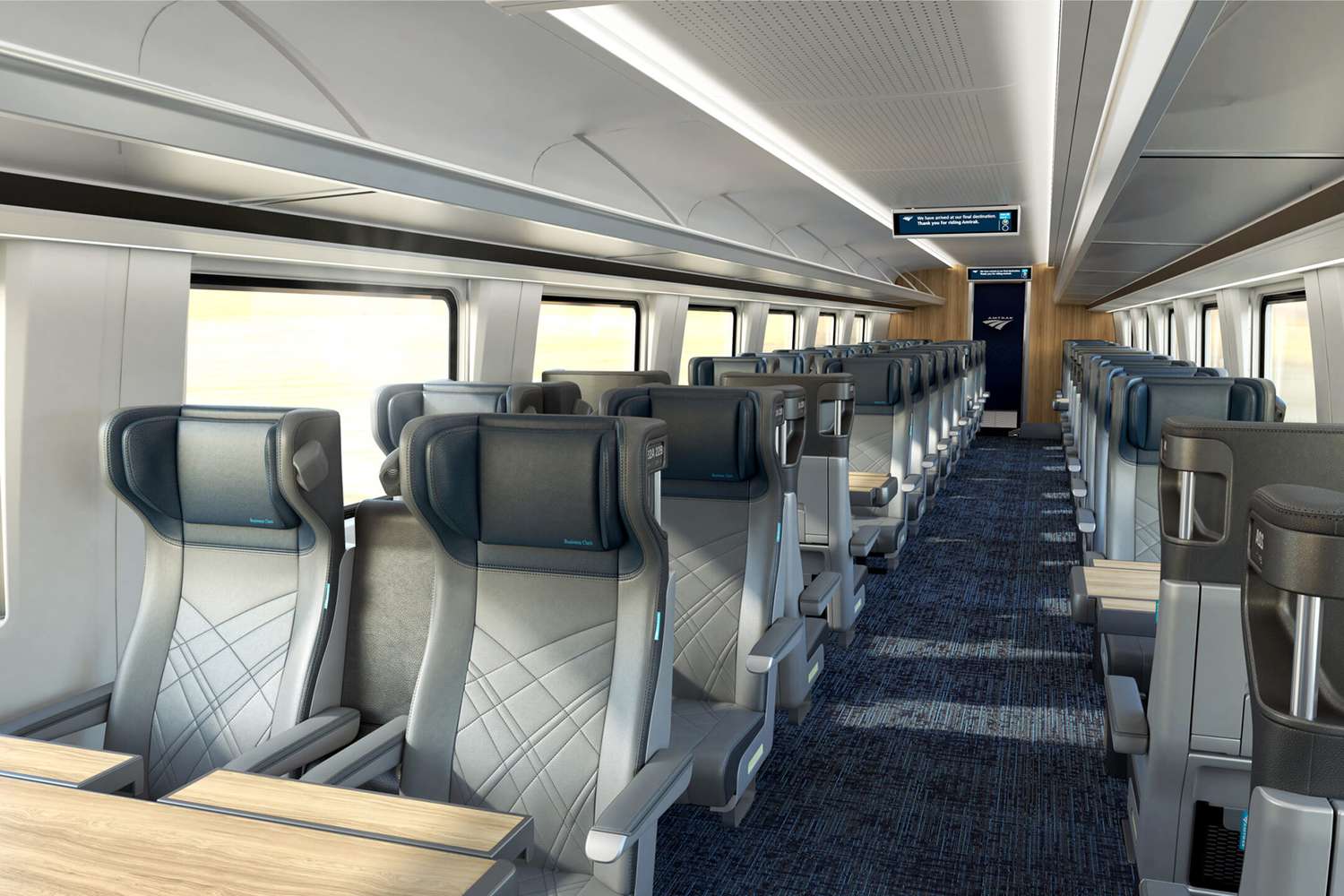 The Interior Of A Train Car With Blue Seats And Flowers On The Windows