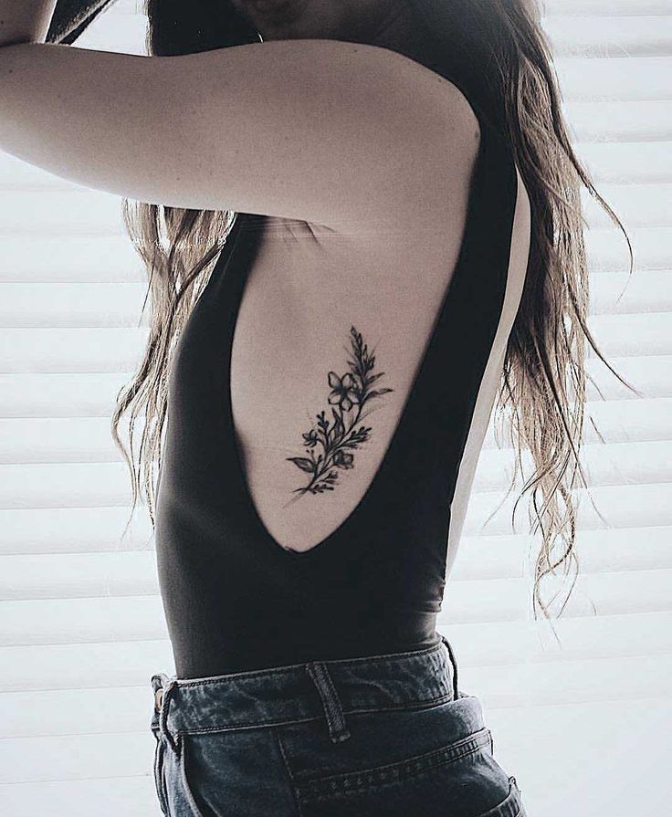 Elegant and Empowering Women's Rib Tattoo Ideas