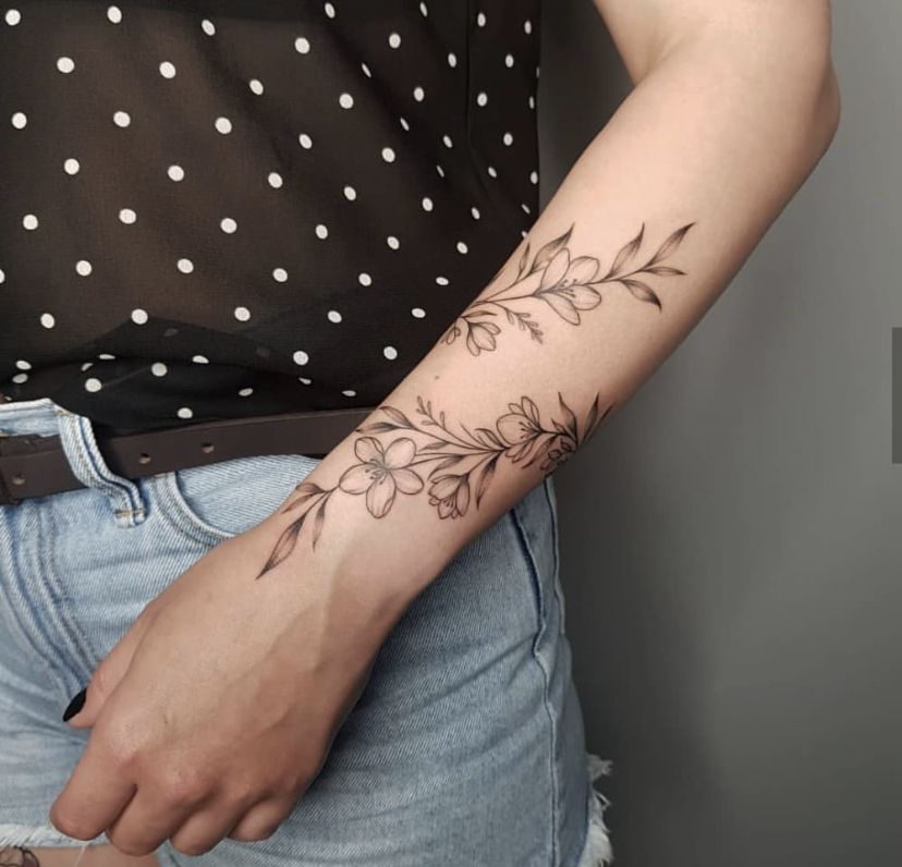 10 Stunning Wrap Around Forearm Tattoo Designs