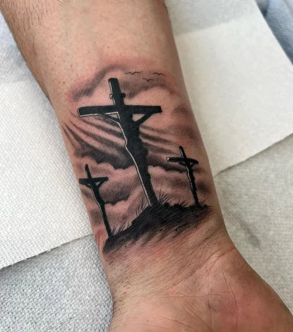 Wrist Tattoo Of A Christian Cross On Tenika